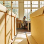 Small business owner reviewing financing options in a modern bright office