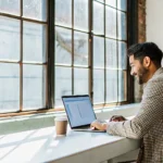 Small business startup owner reviewing financing options on a laptop