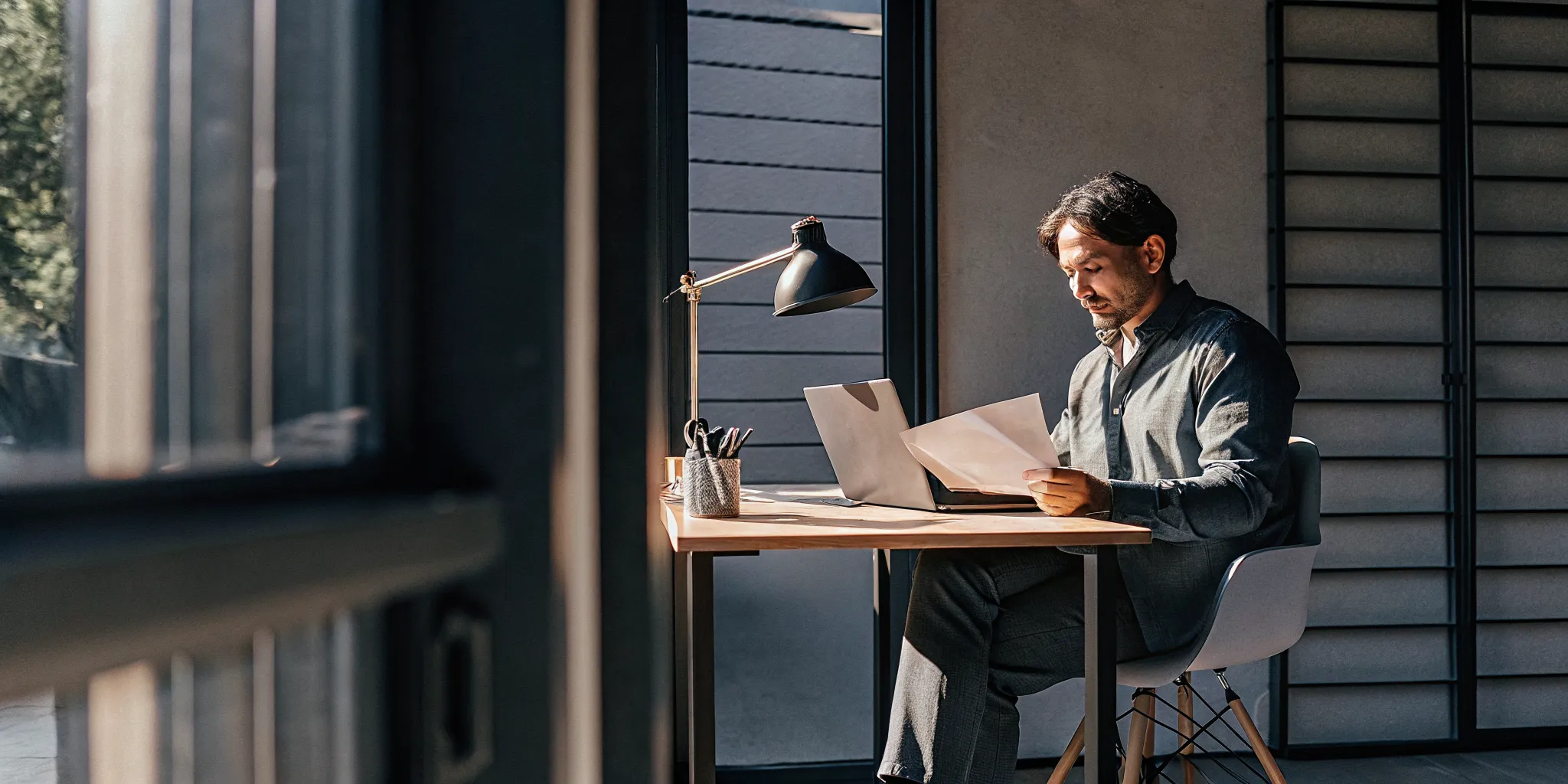 business-loans-for-bad-credit-how-to-get-funded-with-imperfect-credit-817940 Small business owner reviewing loan approval documents on a laptop