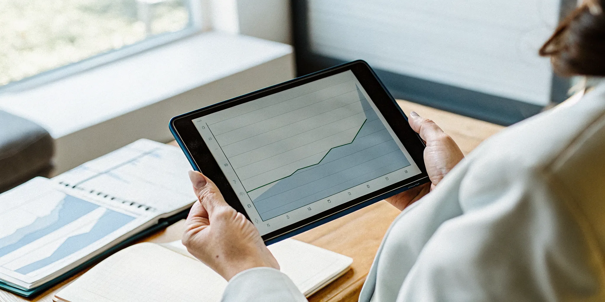 revenue-based-financing-repayment-structure-explained-810800 Small business owner reviewing a flexible revenue-based payment schedule on a tablet