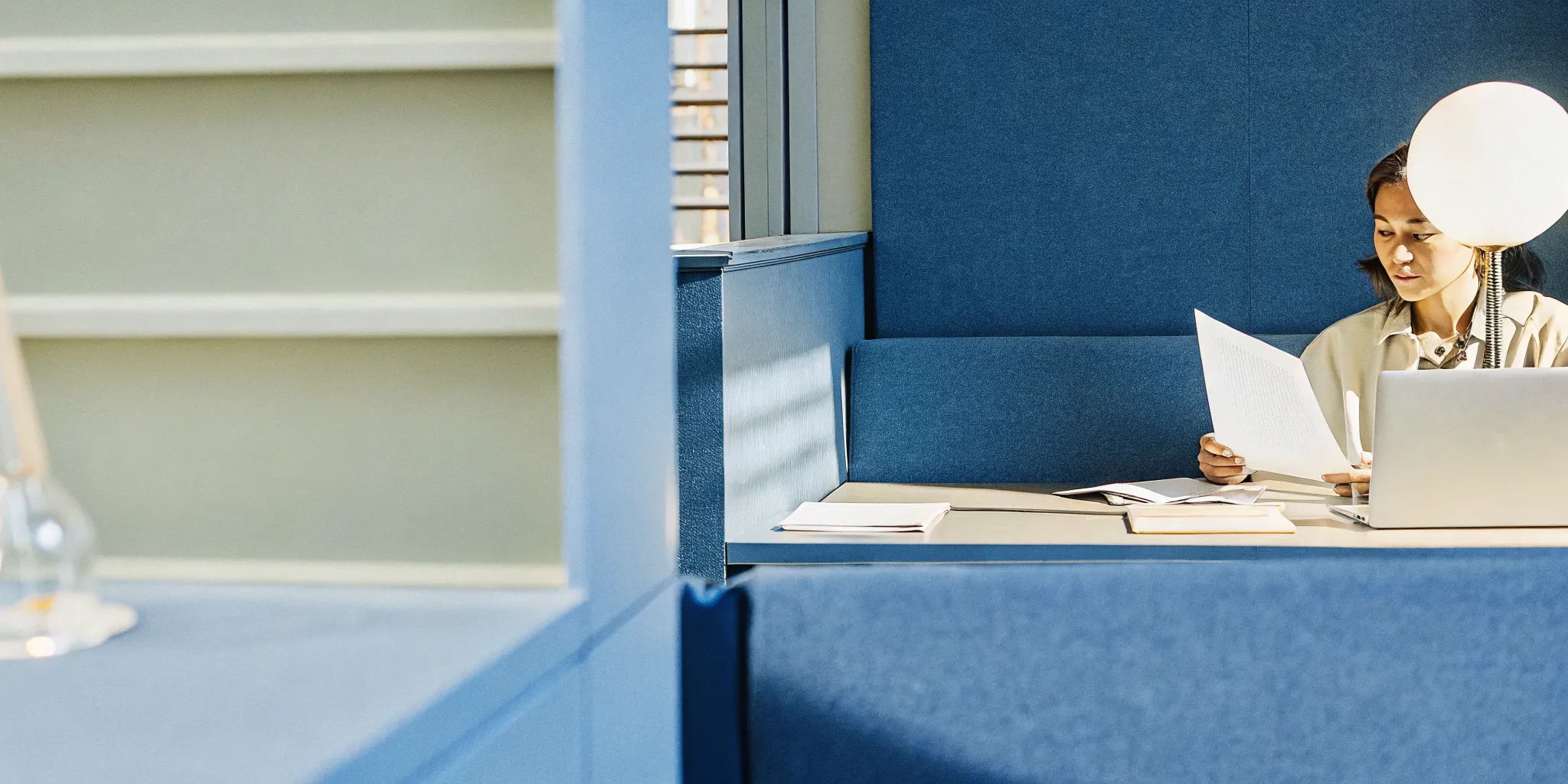 Small business owner reviewing financing documents at a desk