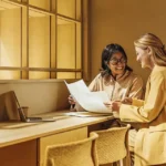 Small business owner reviewing business loan requirements with a financing specialist