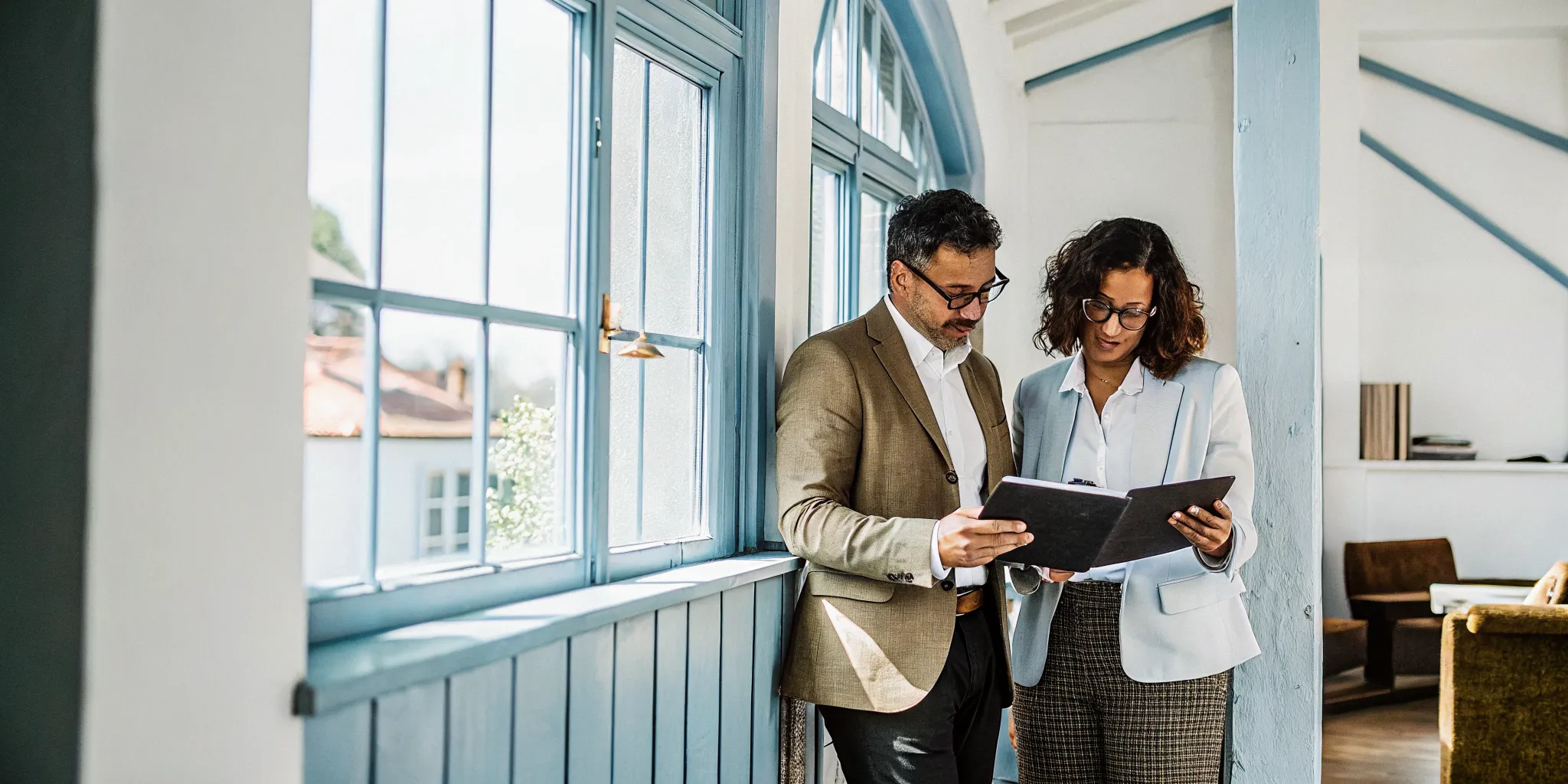 sba-7a-loan-requirements-and-application-steps-125371 Business owner reviewing SBA 7a loan requirements with a financing advisor